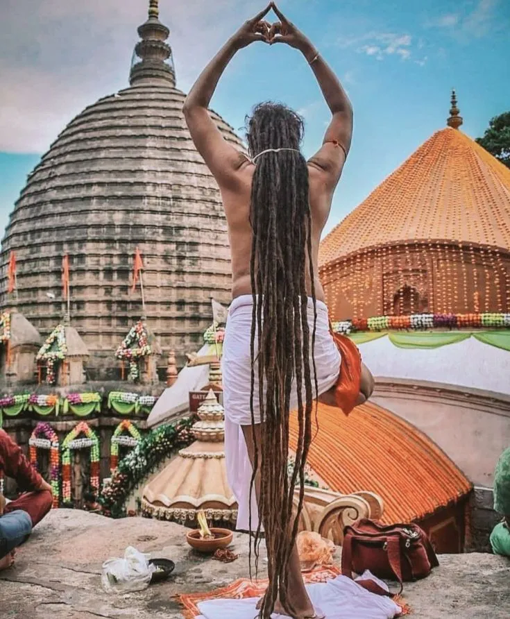 Hindu ascetic in deep prayer at Kamakhya Temple