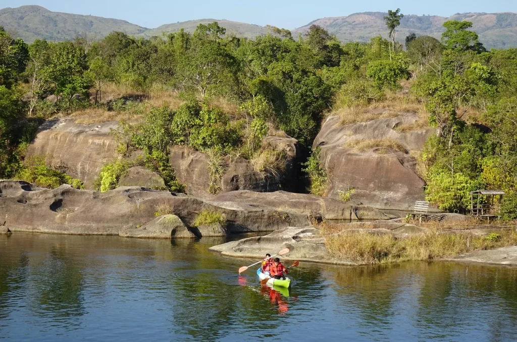 Scenic view of Meghalaya tourist places including waterfalls, hills, and root bridges