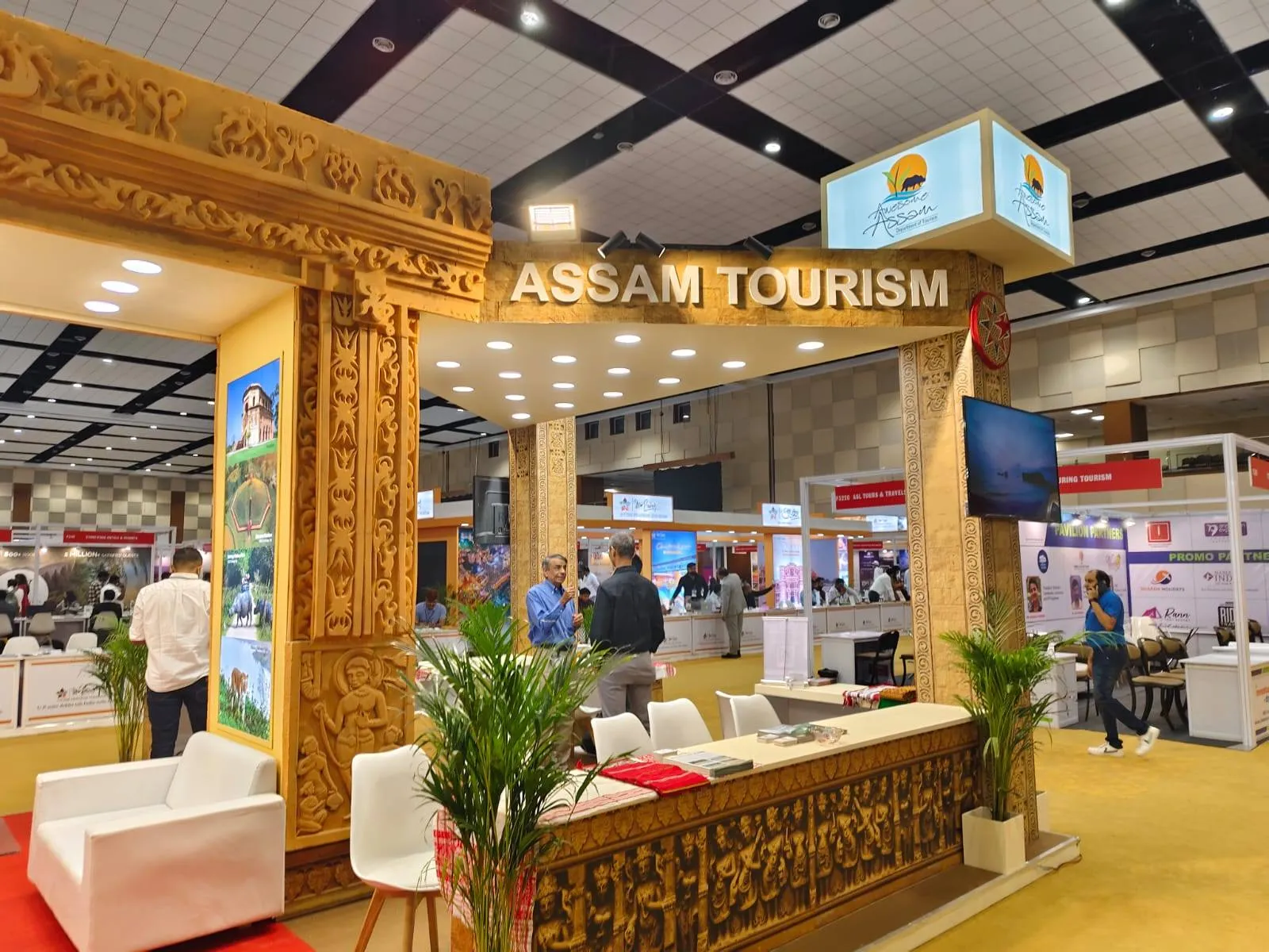Cozy Tour & Travels at TTF Ahmedabad showcasing handcrafted Northeast India tour packages covering destinations like Assam, Meghalaya, Arunachal Pradesh, Nagaland, and Sikkim. 